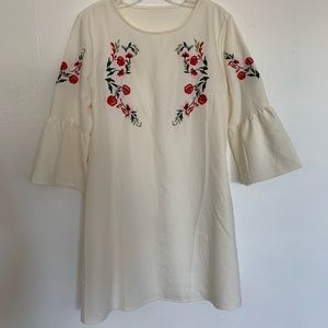 White bell sleeve dress with floral embroidery